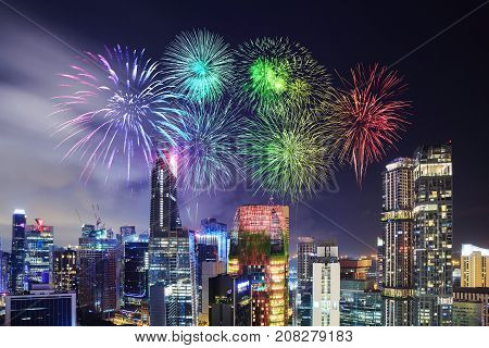 Firework Over Cityscape Of Singapore City At Night