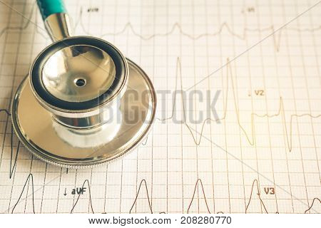 Healthy concept Stethoscope on heart beat wave paper
