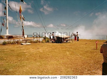 NUKU'ALOFA, TONGATAPU / TONGA - CIRCA 1990: Tongan soldiers fire cannons towards the Pacific Ocean, during a national holiday.
