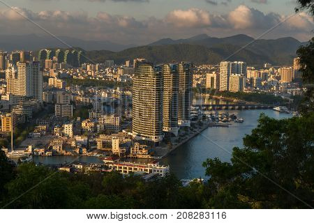 Sanya, China - April 07, 2017: Evening view of Sanya from the top of a hill in a Luhuitou Park