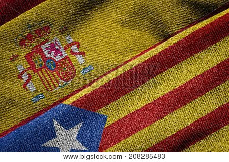 3D rendering of the flags of Spain and Catalonia on woven fabric texture. Detailed textile pattern and grunge theme. Concept of separatist referendum.