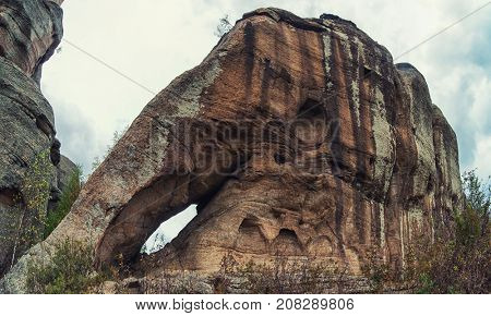 Bizarre forms of weathering of coastal rocks (elephant) , at the Kolyvan lake - a lake at the foot of the northern slope of the Kolyvan Ridge in the Altai Territory of Russia