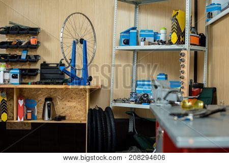 Empty bicycle repair workshop with necessary tools and spare parts