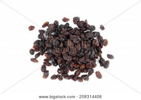 black raisins isolated on white and wooden background