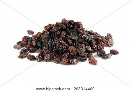 black raisins isolated on white and wooden background