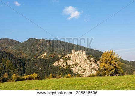 Ruins Of Strecno Castle In Autumn Landscape Under Blue Sky