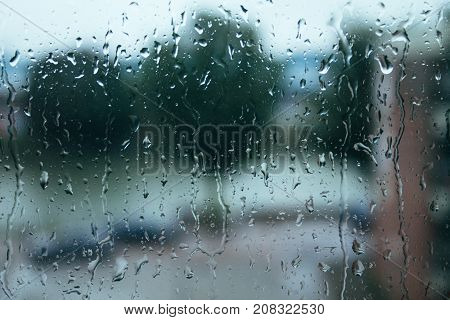 a lot rain drops on the window glass