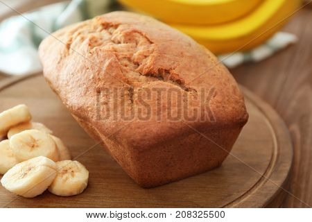 Tasty banana bread on wooden board
