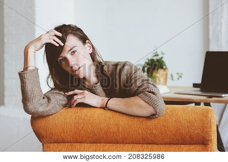 indoor portrait of beautiful feminine thoughtful young women alone in the room.