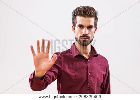 Studio shot portrait of young authoritative businessman.