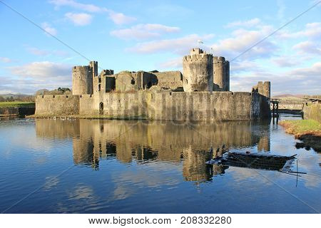 Caerphilly Castle reflected in the lake, Wales