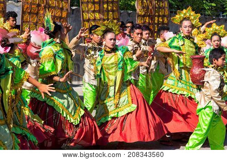 Dumaguete Philippines - 16 September 2017: Sandurot Festival street dancers. Carnival with dancing in colorful costumes. Philippines traditional costumes and dance parade. Girls in spanish dresses