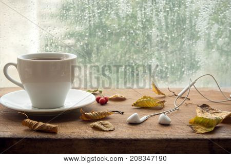 Autumn. Cup Of Coffee And Earbuds.