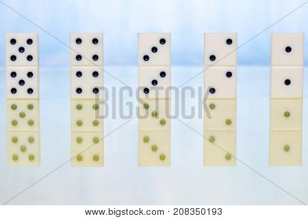 Dominoes on ligth background . . .