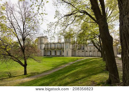 rear end with slant park at dundurn castle in city of hamilton ontario canada trees green grass white sky