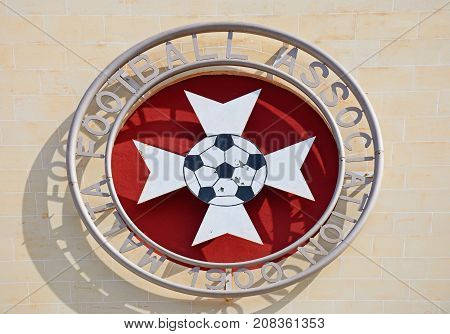 ATTARD, MALTA - APRIL 1, 2017 - Malta football association emblem on the front of the Centenary Stadium Attard Malta Europe, April 1, 2017.