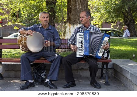 YEREVAN,ARMENIA - SEPTEMBER 24,2017:In the center of Yerevan street unknowns musicians playing a accordion and drum.