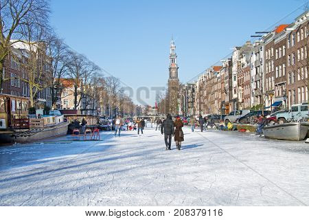 Snowy Amsterdam with the Westerkerk in the Netherlands in winter