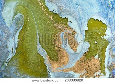 Marbled blue abstract background with golden sequins. Liquid marble ink pattern