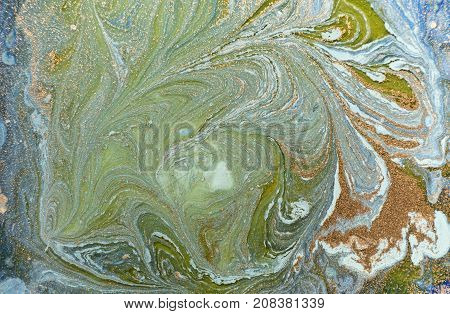 Marbled blue abstract background with golden sequins. Liquid marble ink pattern