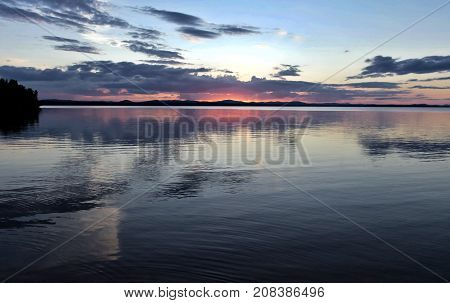 evening colorful cloudy sky over the lake, South Ural, Uvildy