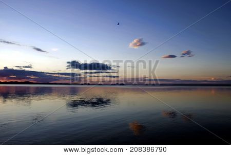 evening colorful cloudy sky over the lake, South Ural, Uvildy
