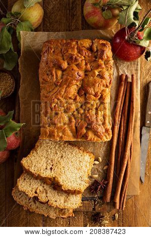 Apple bread rustic style with freshy picked apples and cinnamon, fall baking concept overhead shot