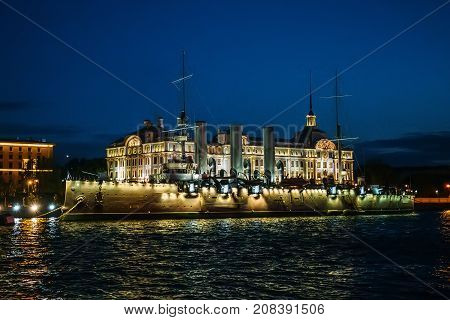Linear cruiser Aurora or Avrora at night, the symbol of the October revolution in Russia, St. Petersburg