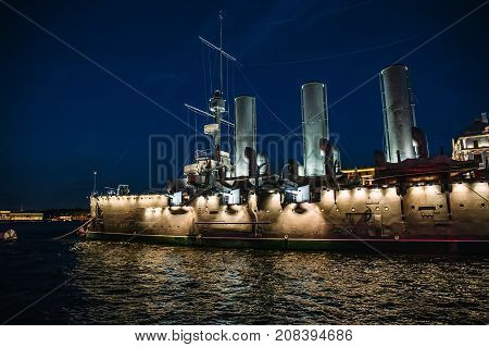 Linear cruiser Aurora or Avrora at night, the symbol of the October revolution in Russia, St. Petersburg