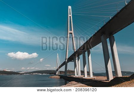 The long handsome cable-stayed bridge on the island is Russian. Beautiful background
