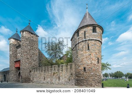 Maastricht beautiful historical gothic gate. Blue sky.