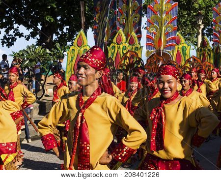 16 Sep 2017 Dumaguete Philippines - smiling children participating in street costume parade. Sandurot festival street dance. Boy in national costume. Philippines festival tradition. Autumn festival