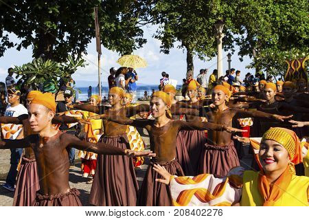 16 Sep 2017 Dumaguete Philippines - smiling children participating in street costume parade. Native costumes of Philippines islands. Sandurot festival. Philippines festival tradition. Street dance