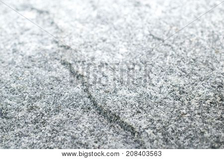 Granitestone textured background with the light bright of the sun. Granite stone is igneous from the magma in the earth.