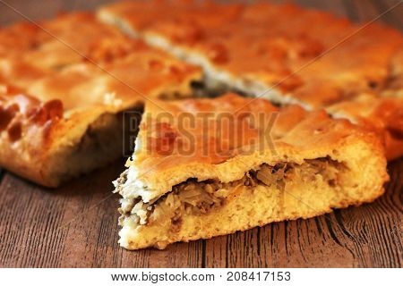 Homemade Australian Meat Pie On The Wooden Table Closeup