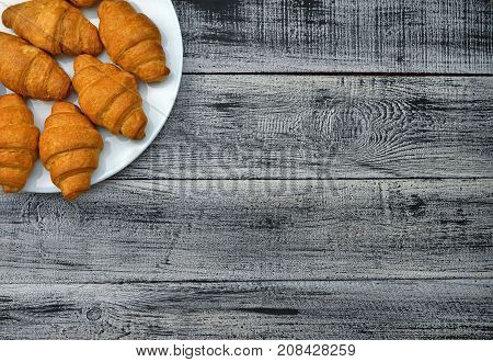 Homemade croissant . Delicious fresh croissant on wood table.