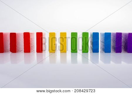 Colorful Domino Blocks In A Line On A White Background