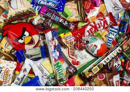 Moscow, Russia - January 02, 2016: Kinder Surprise, Angry Birds, Lindor, Kit Kat, Milky Way, Tempo, Mamba, Brasilica, Pancake, Michaszki and many other candies, chocolates and sweets for kids manufactured by different companies. Studio shot.