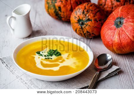 Pumpkin soup with cream and parsley. Vegan food.