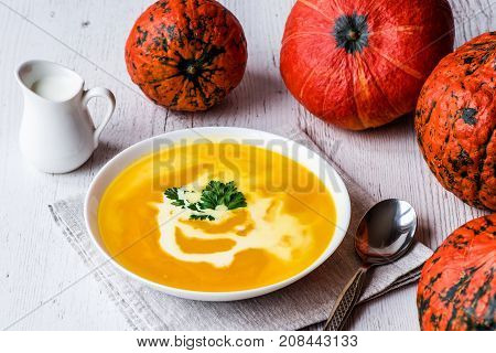 Pumpkin soup with cream and parsley. Vegan food.