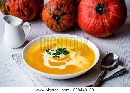Pumpkin soup with cream and parsley. Vegan food.