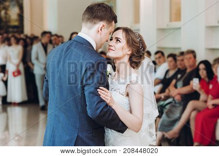 Beautiful Gorgeous Bride And Groom Performing First Dance. Happy Wedding Couple Dancing In Restauran