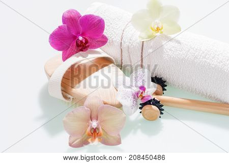 Spa concept hand towel and equipment with orchid flowers