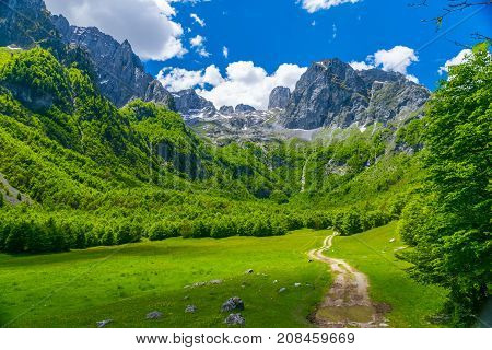 Picturesque Meadows And Forests Are Located Among The High Mountains.