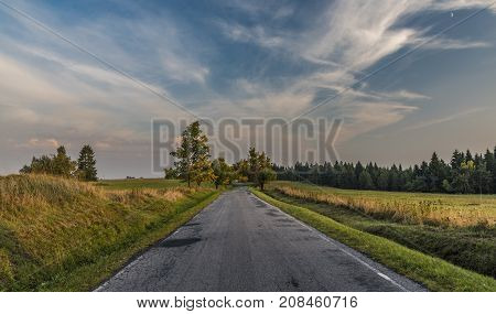 Color evening with road in Slavkovsky les national park in autumn time