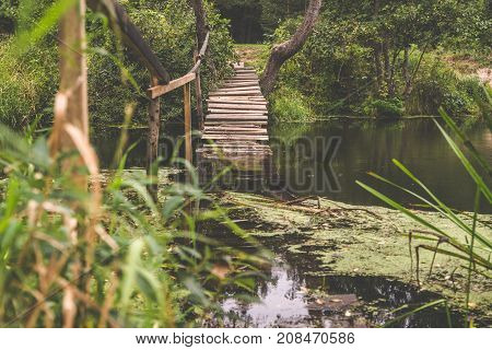 Old bridge over the river at dawn