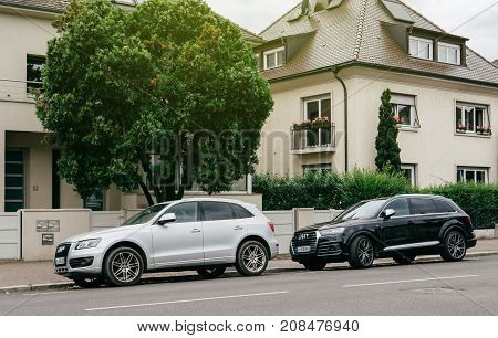 PARIS FRANCE - JUN 25 2017: Two luxury allroad Audi vehicles parked in an upper-class neighbourhood in Strasbourg France