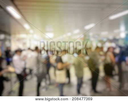 Blurred Image Of Asian People On The Queue Line On Rush Hour Waiting For Train Subway Station. Stay