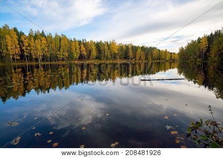 The Smooth Surface Of The Lake Like A Mirror . Autumn Landscape