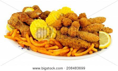 Plate of Southern fried chicken products with sweetcorn and fries